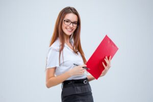 Smiling Young Business Woman In Glasses With Pen And Clipboard 1